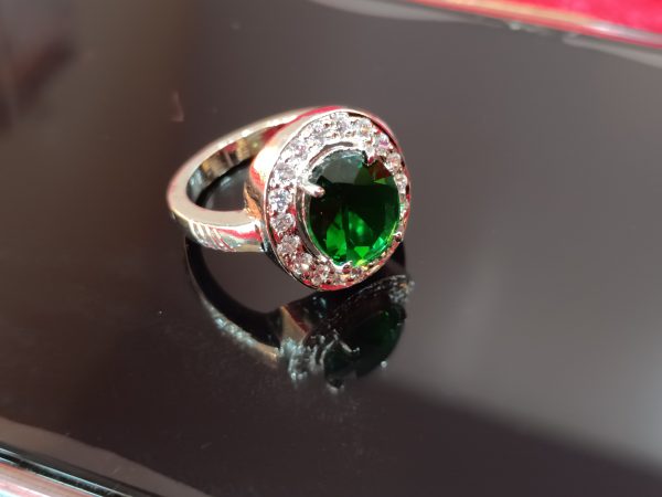 Elegant Sterling Silver Ring with Oval Green Gemstone and Halo of White Stones