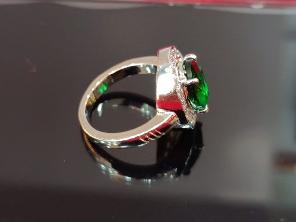 Elegant Sterling Silver Ring with Oval Green Gemstone and Halo of White Stones - Image 2
