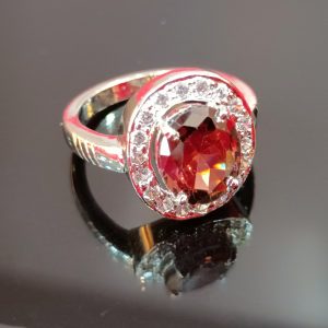 Elegant Oval-Cut Brown Gemstone Ring with Halo Setting in Sterling Silver