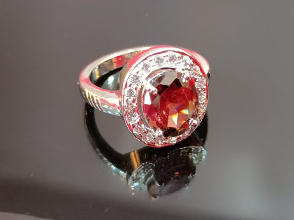 Elegant Oval-Cut Brown Gemstone Ring with Halo Setting in Sterling Silver