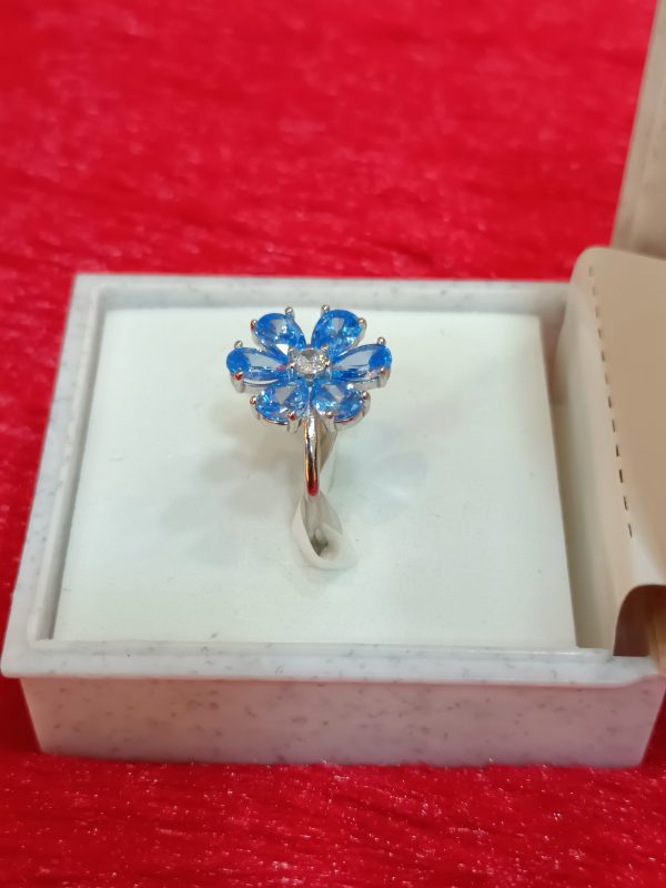 Silver Flower Ring with Sky-Blue Petal Gemstones - Image 4