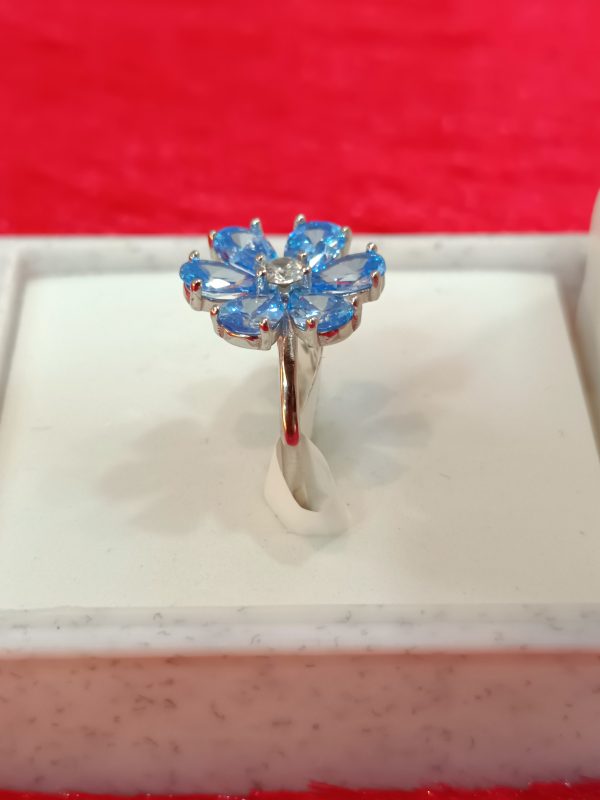 Silver Flower Ring with Sky-Blue Petal Gemstones - Image 5