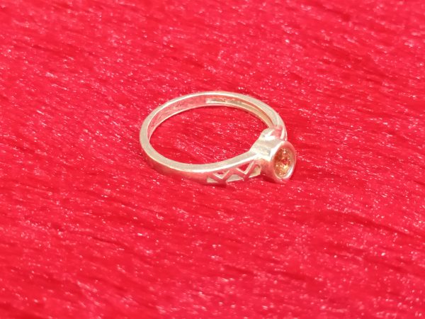 Geometric-Shouldered Ring with Warm-Toned Center Stone