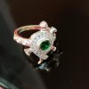 Sterling Silver Turtle Ring with Green Stone Center – Pavé Detailing & Scroll Band Design