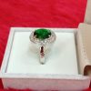 Elegant Sterling Silver Ring with Oval Green Stone and Halo of White Stones - Image 4