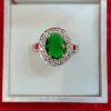 Elegant Sterling Silver Ring with Oval Green Stone and Halo of White Stones - Image 3