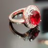 Women's Sterling Silver Ring with Red Oval Center Stone and Halo of White Cubic Zirconia - Image 2