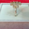 Ring with Olive Green Petals and Clear Baguette Stones - Image 2