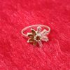 Ring with Olive Green Petals and Clear Baguette Stones - Image 4