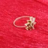 Ring with Olive Green Petals and Clear Baguette Stones - Image 5