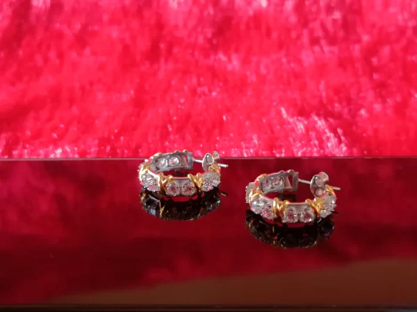 Round Brilliant Diamonds Topped by Golden Xs Hoop...